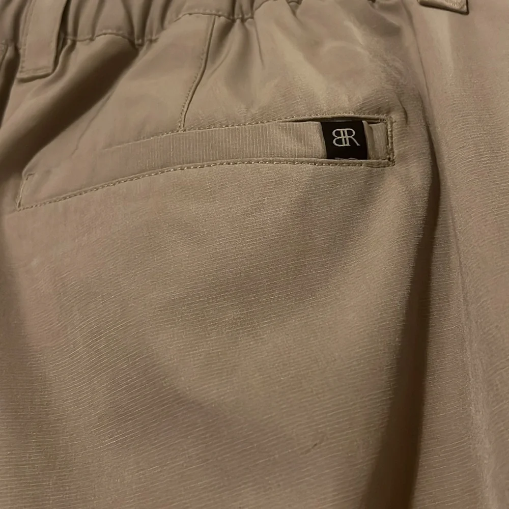 Banana Republic flat front tan shorts. Back elastic waist for comfort.